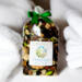 Cotton Fields potpourri bag by Irish Twins, featuring natural dried botanicals and a fresh, clean scent, nestled amongst soft white towels.